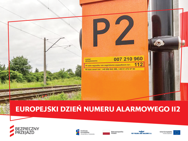 Napęd rogatkowy z żółtą naklejką PLK z podpisem Europejski dzień numeru alarmowego 112