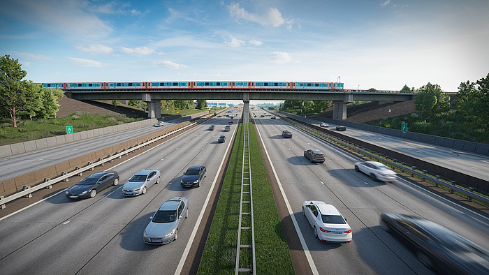 Widok na autostradę z samochodami, w tle wiadukt z pociągiem.